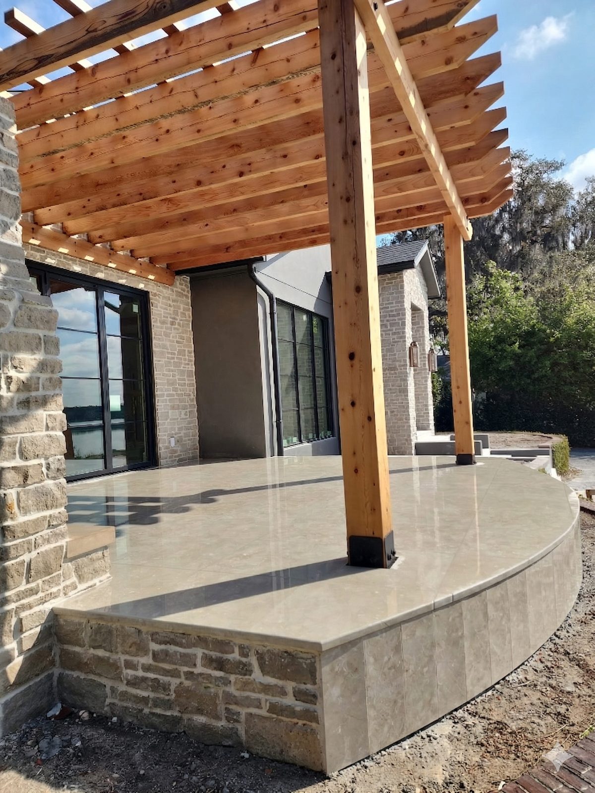 Travertine patio & pergola installed by Lakewood Ranch Concrete in Lakewood Ranch, FL